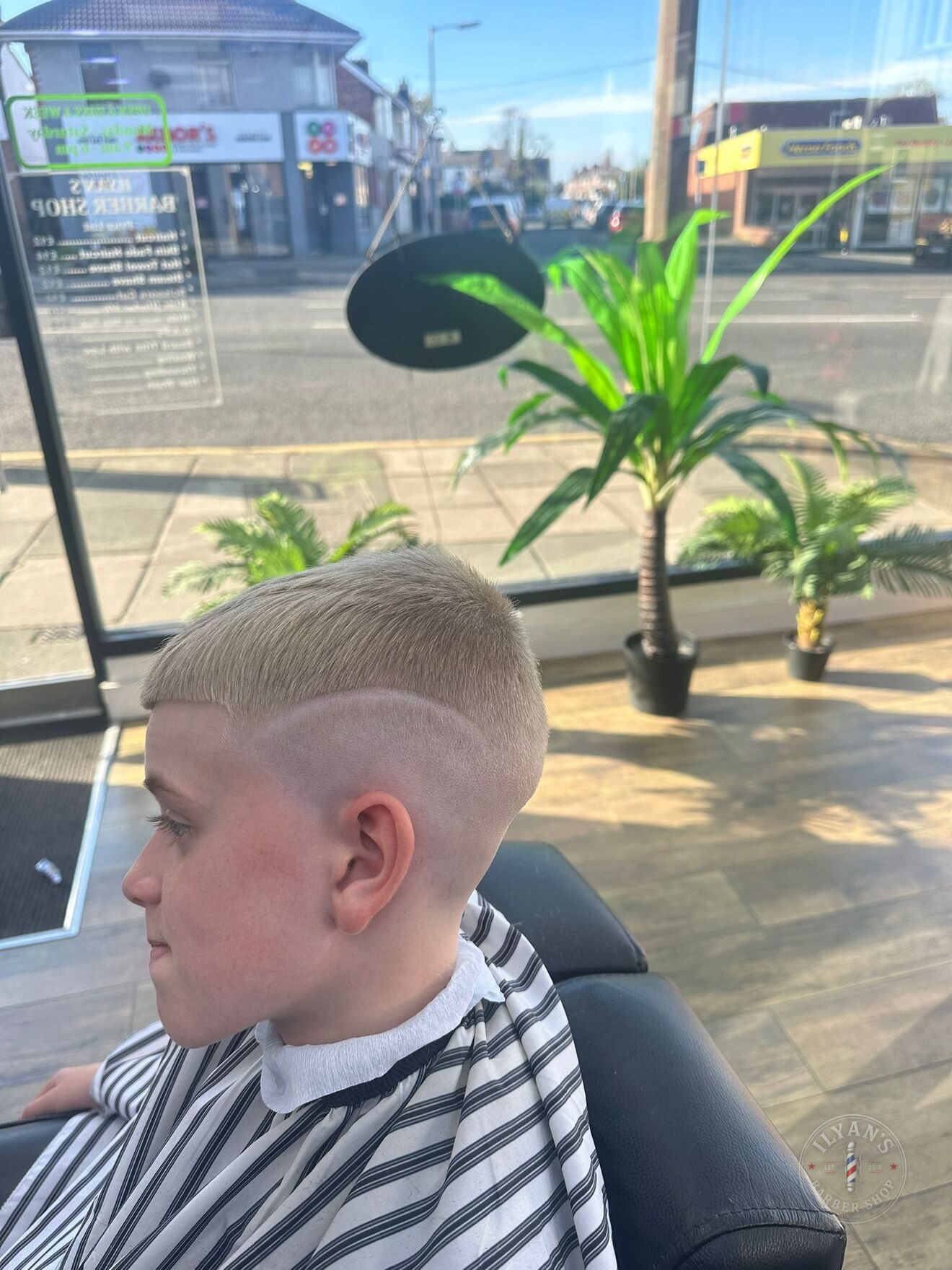 A high fade at Ilyan's Barber Shop, taken up near the crown